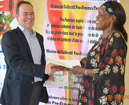 TMEA country director Mark Priestley (L) and Jean du2019Arc Kanakuze during the MOU signing at the Profemme offices. The Sunday Times / Courtesy