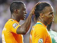 Yaya Toure consoles Didier Drogba, who missed a penalty in normal time. Net photo
