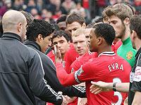 Luis Suarez (2nd left) did little to help his cause, refusing Patrice Evra's handshake prior to kick-off. Net photo