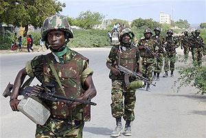 A group of deployed African Union peacekeepers from Burundi walk along the streets of Mogadishu. Net photo