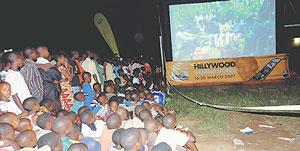 Revellers watch a movie at one of Hillywoods inflatable screens. File photo.