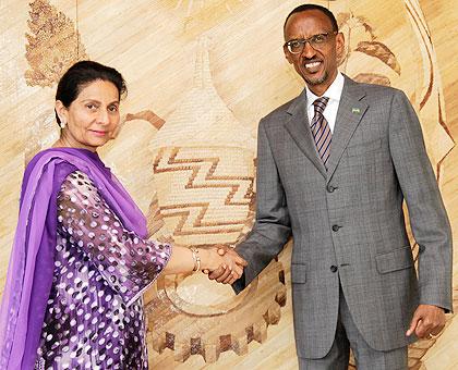 The Indian State Minister for External Affairs Preneet Kaur, (L) shake hands with President Paul Kagame after the meeting. The New Times / Timothy Kisambira.