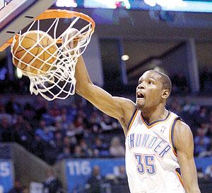 Oklahoma City Thunder forward Kevin Durant dunks against Denver Nuggets. Net photo.