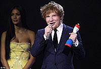 Rising star. Ed Sheeran collects the Best Male Solo Artist award, and also won British Breakthrough Act.