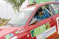 Fitidis waves to the crowd shortly after being flagged off during the super special stage of the 2009 KCB Rwanda Mountain Gorilla rally. The New Times/File.