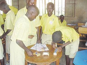 Students in a practical physics lesson. Practical-oriented educational training is what creates a hands-on labour force.  The New Times / File.