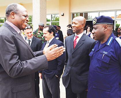 Dr Francis K. Sang, Executive Secretary,  Regional Centre on Small Arms (L), chatting with Internal Security Minister Musa Fazil Harerimana and IGP Emmanuel Gasana yesterday.  The New Times / Timothy Kisambira. 