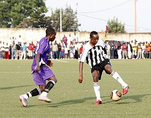 APR winger Jean Claude Iranzi (R) is ruled out of tomorrow's game because of a knee injury. The New Times / File.