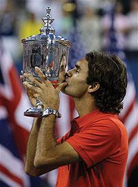 Federer kisses the Dubai Tennis Championship trophy shortly after beating Murray in the final