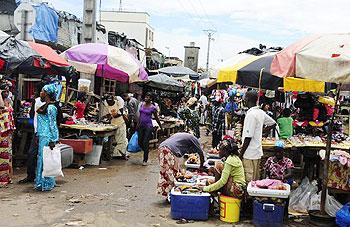 Shoppers buy products at a market in Conakry, Guinea in 2010. Fifty people travelling to a weekly market were on Saturday killed and 27 injured when the lorry they were travelling in crashed