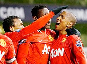 Manchester United's Ashley Young (R) celebrates his goal during yesterday's English Premier League match against Tottenham