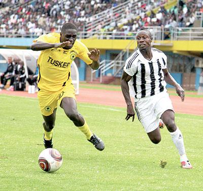 APR striker Kabange Twite (R) trying to go past a Tusker defender. Coach Ernest Brandts is full of confidence ahead of the military sideu2019s game against Etoile du Sahel. The New Times/T. Kisambira.