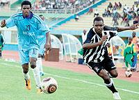 APRu2019s Albert Ngabo (R) vies for the ball with Isongau2019s Ruhinda Saifi Farouk during their League match at Amahoro Stadium yesterday. Isonga won 2-1. The New Times/T. Kisambira.