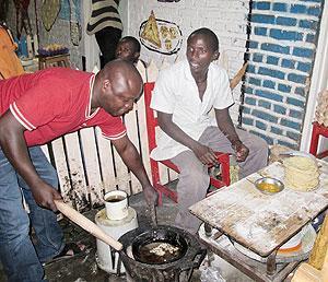 The writer tries out his cooking skills at Mama Uwerau2019s roadside eatery