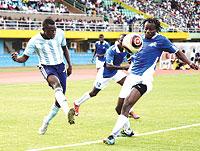 Laudit Mavugo tries an attempt past Rayon Sport's Floribert Ndayisaba during yesterdayu2019s game. The New Times, T. Kisambira.