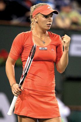 Caroline Wozniacki of Denmark celebrates a point against Sofia Arvidsson of Sweden during the BNP Paribas Open. 