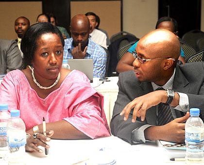 Health Minister Dr. Agnes Binagwaho (L) listens to NISR Director General Yusuf Murangwa  during the meeting. The New Times / John Mbanda.