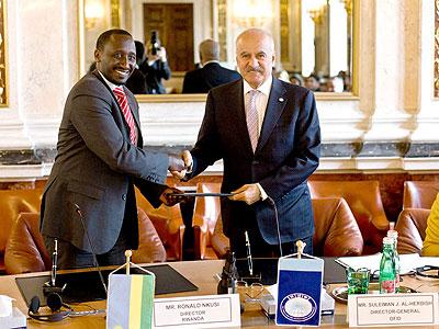 Ronald Nkusi with the Director General of OFID, Suleiman J. Al-Herbish at the signing in Vienna. The New Times / Courtesy.