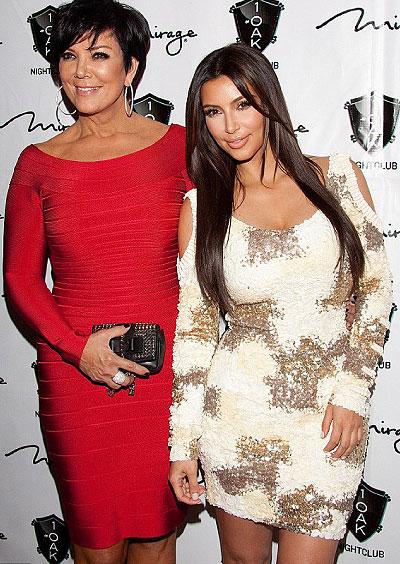 Figure-hugging: Kim arrived with her mother Kris Jenner, who was wearing a red bandage dress