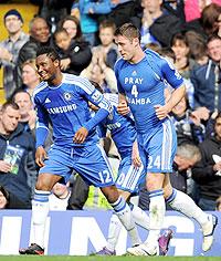John Obi Mikel celebrates with goal scorer Gary Cahill who shows his support for Fabrice Muamba during the FA Cup sixth round match between Chelsea and Leicester City. Net photo.