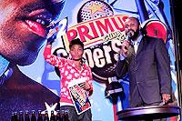 Primus Guma Guma Superstar host, Lion Imanzi on stage with aspiring rapper, Young Grace.