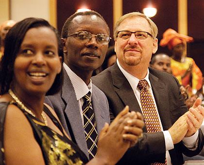Pastor Antoine Rutayisire and wife, together with Pastor Rick Warren, during yesterday's Prayer Breakfast in Kigali. The New Times / Timothy Kisambira.