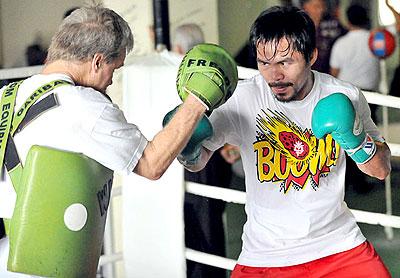 Manny Pacquiao is at hard work with his coach Freddy Roch for last Novemberu2019s pay-per-view showdown with Antonio Margarito. Net photo