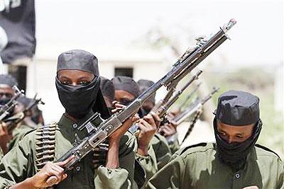 New recruits belonging to al Shabaab rebel group march during a passing out parade at a military training base in Somalia. Net photo.