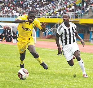 APR striker Kabange Twite (right) vies for the ball with a Tusker FC defender during the last round. APR take on Tunisiau2019s Etoile du Sahel this afternoon that Amahoro stadium. The New Times / T. Kisambira.