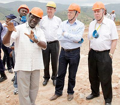 Dr Michael Biryabarema, the Director General of the Geology and Mines Department in the Ministry of Natural Resources, leads members of the Presidential Advisory Council (PAC) during a guided tour of a wolfram mining facility in Rutobwe. The Sunday Times/