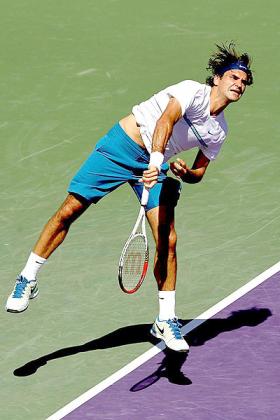 Roger Federer of Switzerland serves to Ryan Harrison during the Sony Ericsson Open. Net photo.