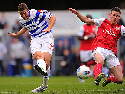 A shock is on the cards at Loftus Road when Adel Taarabt spins off Thomas Vermaelen and fires a low strike into the bottom corner. Net photo.