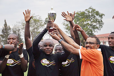 Remera Bufalloes players celebrate with the trophy after winning the two-day tournament. The New Times / U. Komugisha.