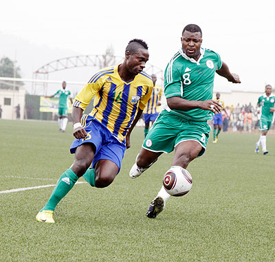 Amavubi Stars' defender Mbuyu Twite (L) kept Nigeria's striker Yakubu Aiyegbeni quiet throughout when the two sides met in the 2013 Afcon qualifier first leg in Kigali. The New Times / T. Kisambira.