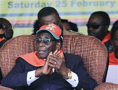 Zimbabwe President Robert Mugabe listens to speeches during his 88th birthday in Harare, February 25, 2012. Net Photo.
