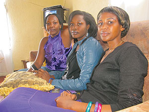 Philomene Kantengwa ( L) with her two other siblings at the home they where given by Solace Ministries sponsors.The New Times / D. Umutesi