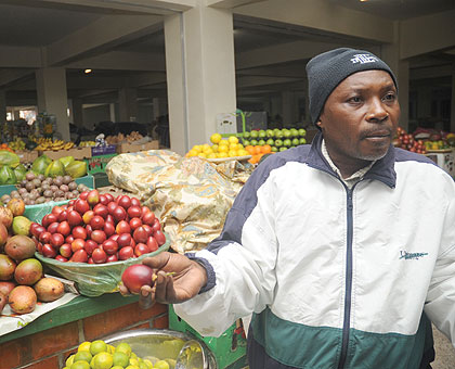 NO COMPENSATION: A fruit  vendor at the closed city market. The New Times / File.