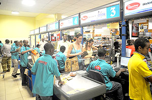 Shoppers at a Nakummatt outlet in Kigali. The giant retailer is set to open a third branch in the capital. The New Times.