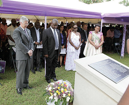 Us ambassador Donald Koran (L) Joseph Rurangwa, head of Rwandans working at the embassy, and Immaculee Mukantaganira, widow of one of the victims (R), and embassy staff, observe a moment of silence in honour of the Genocide victims. The New Times / T. Kis