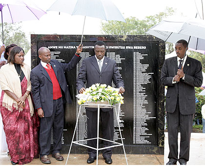 Senate president Dr Jean Damascene Ntawukuliryayo lays a wreath in honour of the victims of the Genocide against the Tutsi, as Dr Alvera Mukabaramba, Spokesperson, the consultative forum for political parties, (L) and Jean de Dieu Mucyo, president, the Na