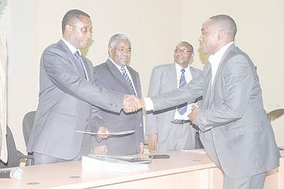 The Minister of Education Dr. Vicent Biruta  congratulates one of the graduates. The Sunday Times/ Grace Mugoya