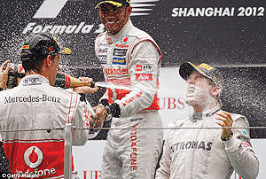 Nico Rosberg (right) celebrates his win in China with Jenson Button and Lewis Hamilton. Net photo.