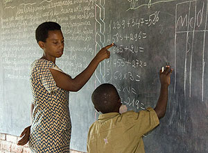 A teacher and a pupil: Rwanda has been proactive in attracting qualified labour from other EAC countries.  The New Times / File.