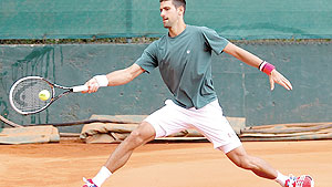 Novak Djokovic plays a return to during a training session of the Monte Carlo Tennis Masters tournament. Net photo.