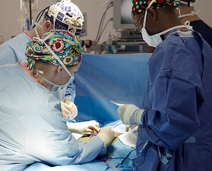 Doctors carry out an open Heart surgery at King Faisal Hospital yesterday. The New Times / Timothy Kisambira.