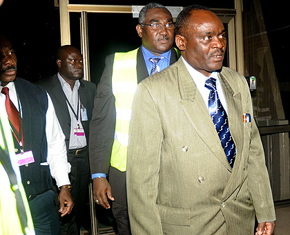 Jean Bosco Uwinkindi on arrival at Kigali International Airport last evening. Behind him is Roland Amousouga, the ICTR Spokesperson. The New Times / John Mbanda.