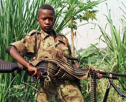A boy soldier strikes a pose. The threat to good social order cannot be over emphasised. The New Times/ Net photo.