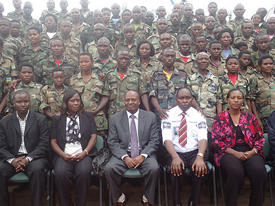 Community welfare mobilisers pose for a group photo with leaders. The New Times / B. Mukombozi.