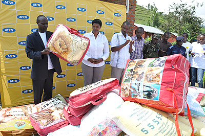MTN's Norman Munyampundu (L) hands over the donation to Karongi District Vice Mayor in charge of social affairs Dativa Mukabalisa. The New Times / Courtesy.