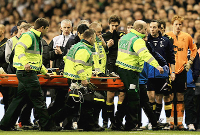 Boltonu2019s Fabrice Muamba is carried off the field on a stretcher after collapsing playing against Tottenham. Net photo.